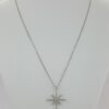 0.1 ct 18K White Gold Round Cut Diamond Snowflake / Starburst Cross Pendant