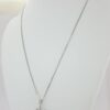 0.1 ct 18K White Gold Round Cut Diamond Snowflake / Starburst Cross Pendant
